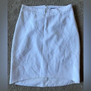 White pencil skirt, zipper closure in the back.